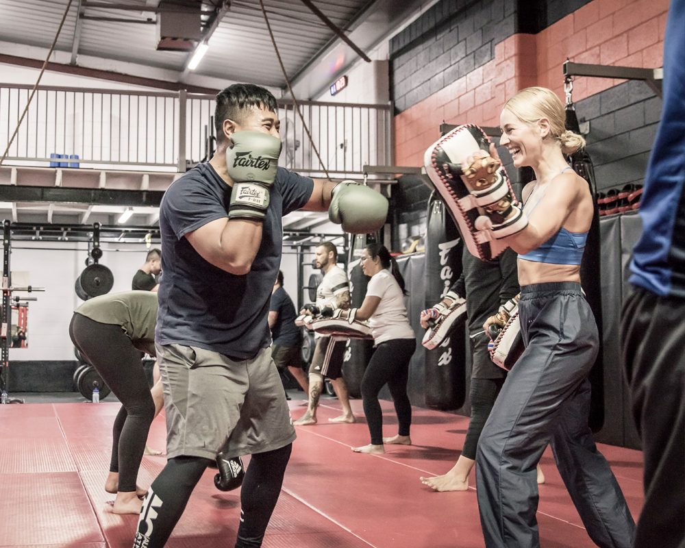 Fitness kickboxing class at Chau Kaizen in Prospect, members working pads in pairs