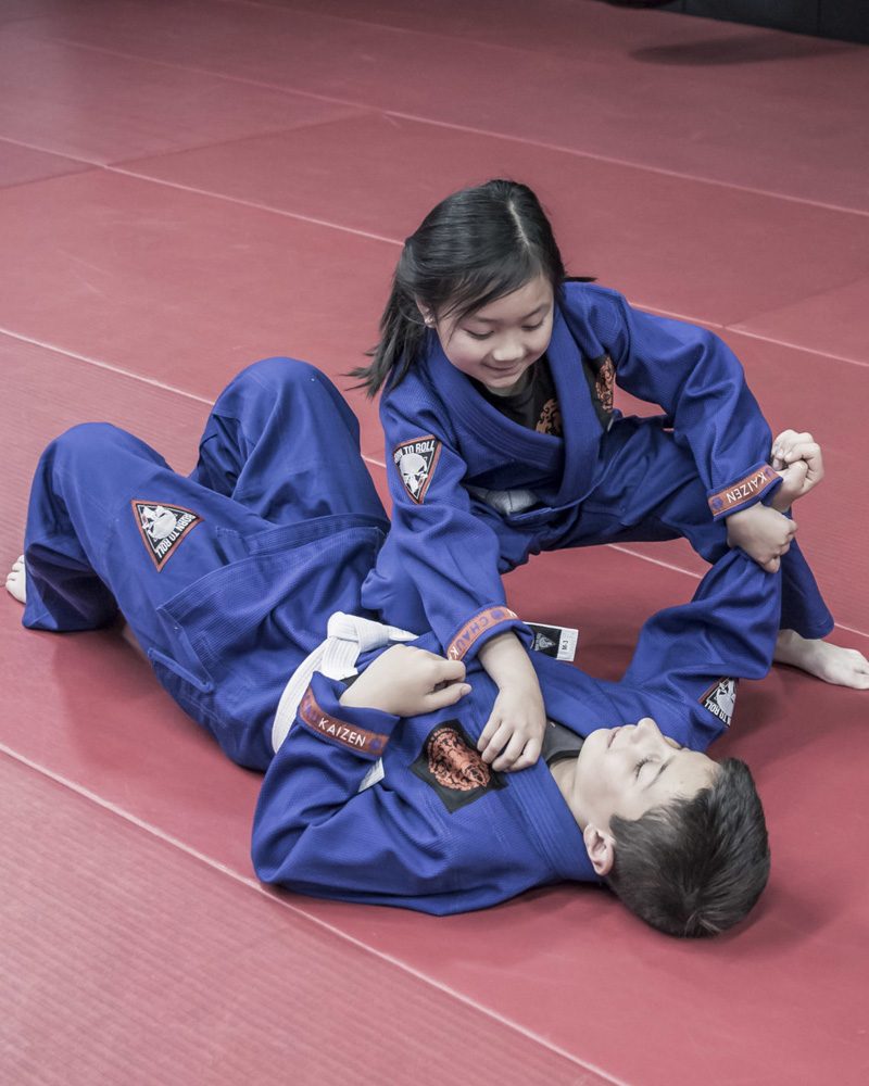 Two children in blue gis practising Brazilian Jiu Jitsu at Chau Kaizen in Prospect