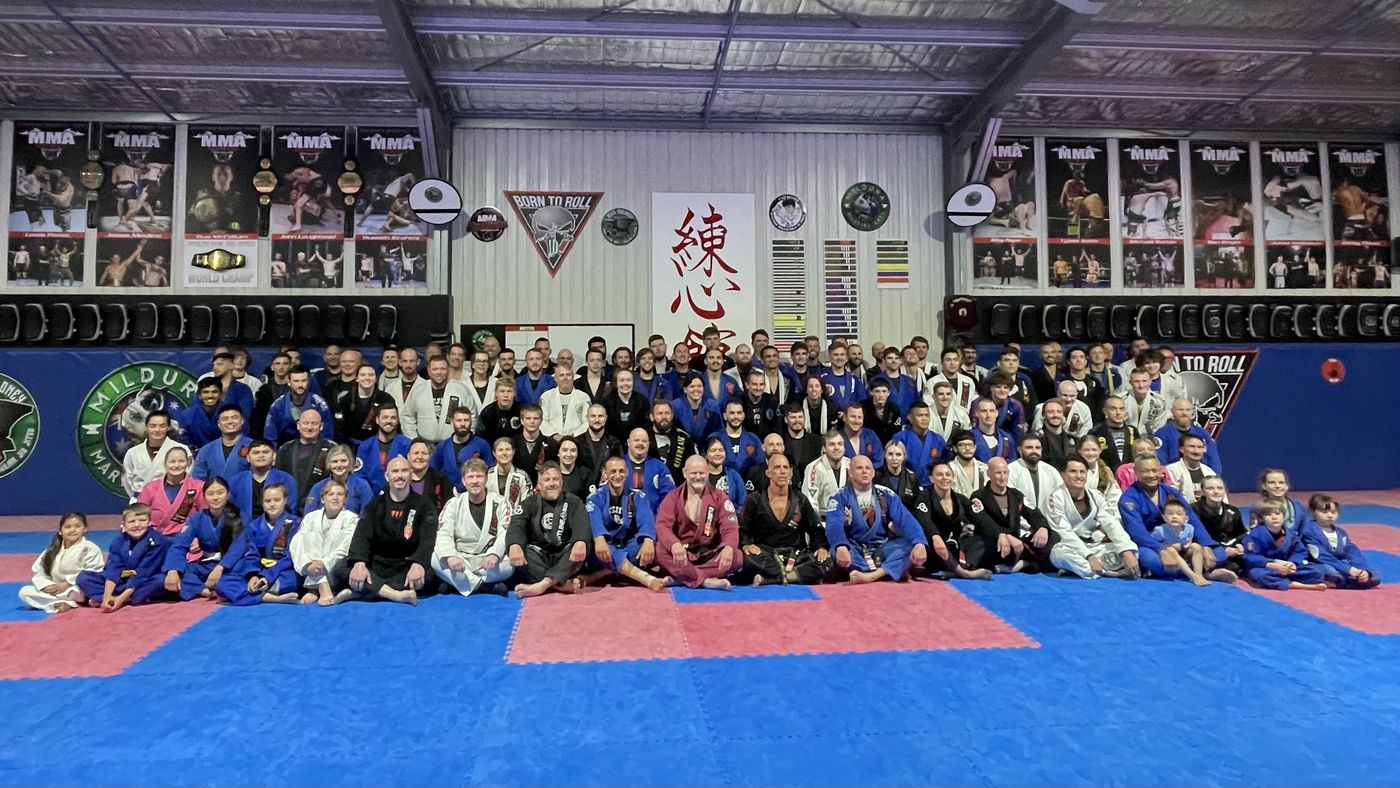 Group photo at the Brazilian Jiu Jitsu grading where Suasday Chau received his black belt